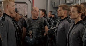 Michael Ironside, Dina Meyer, Casper Van Dien, and Jake Busey in Starship Troopers (1997)